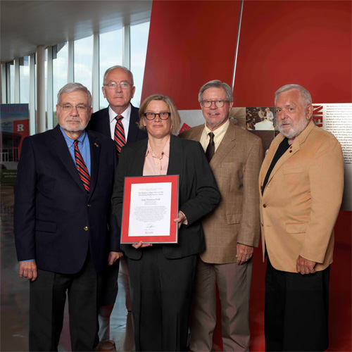 Dr. Anne Morrison Piehl receiving her award
